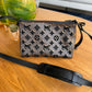 Bolsa Louis Vuitton Monogram Tuffetage Triangle Marrom