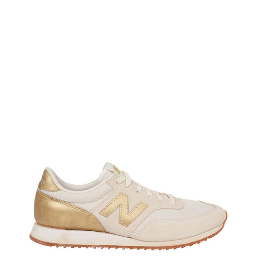 Tênis New Balance Off White e Dourado TAM. 38,5 Br
